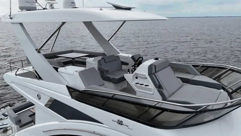 Slide: The Image of 2021 Cruisers Yachts 60 Cantius Flybridge on open water, showcasing sleek design and luxury features. - 44