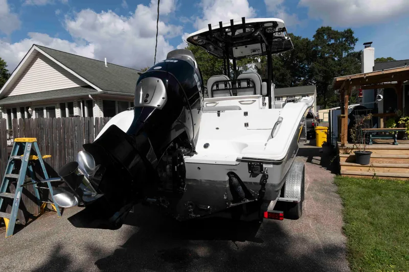 Slide: The Image of 2020 Sea Pro 259 Center Console boat with powerful outboard motor in residential driveway. - 26