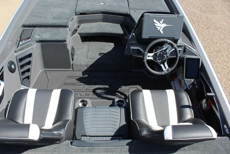 Slide: The Image of 2026 Skeeter FXR21 FLEX boat interior with dual seats, steering wheel, and control panel. - 10