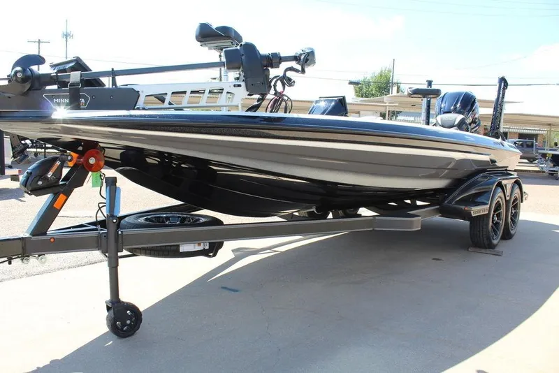 Slide: The Image of 2026 Skeeter FXR21 FLEX boat on trailer, showcasing sleek design and advanced features. - 12