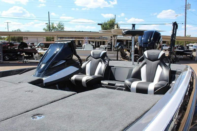 Slide: The Image of 2026 Skeeter FXR21 FLEX boat interior with sleek seats and modern dashboard. - 13