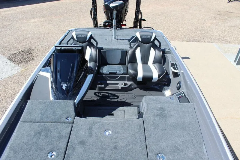 Slide: The Image of 2026 Skeeter FXR21 FLEX boat interior with dual seats and carpeted deck. - 17