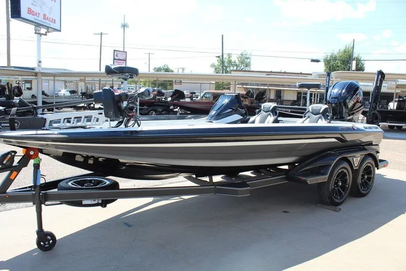 Slide: The Image of 2026 Skeeter FXR21 FLEX boat on trailer at dealership, side view. - 7