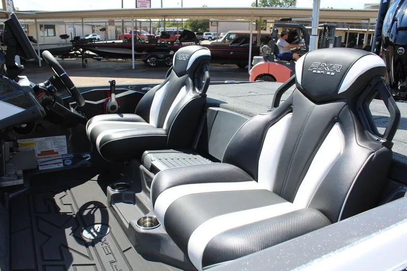 Slide: The Image of 2026 Skeeter FXR21 FLEX boat interior with sleek, modern seating and advanced controls. - 8