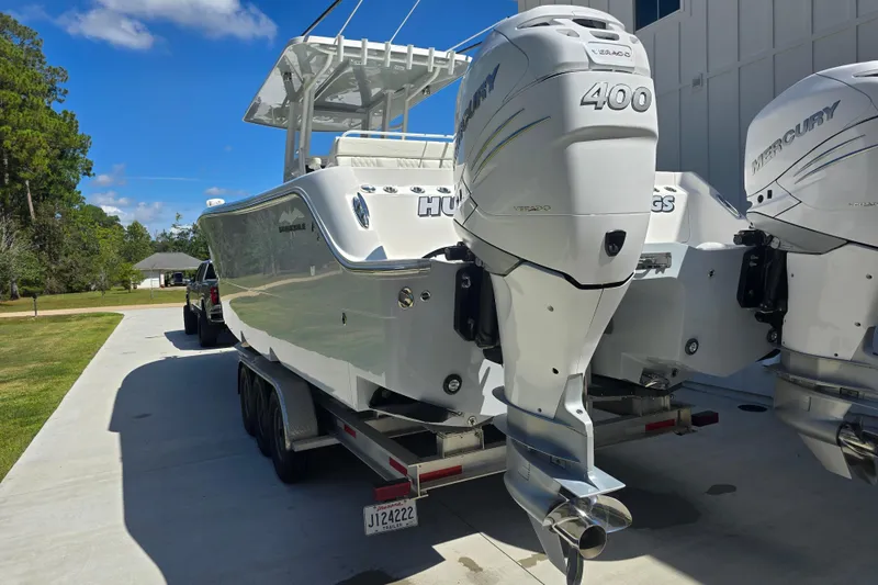 Slide: The Image of 2022 Invincible 33 Catamaran with dual Mercury 400 engines on trailer. - 16