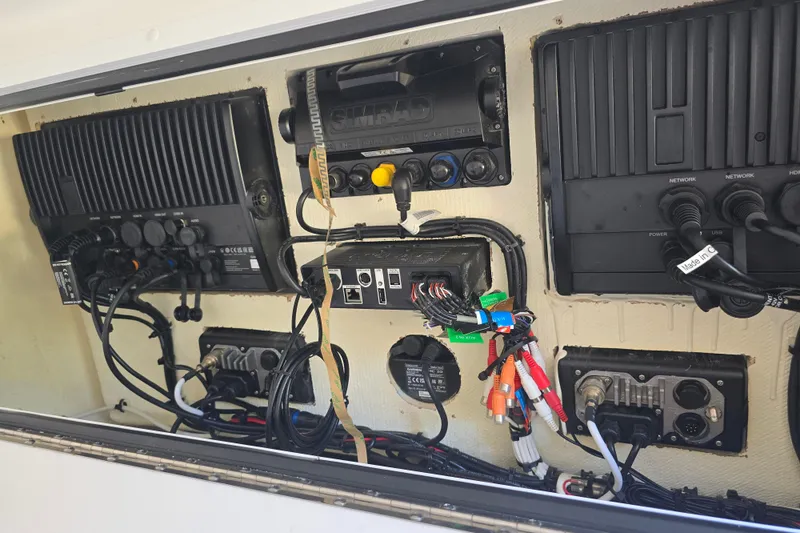 Slide: The Image of Electrical panel of 2022 Invincible 33 Catamaran with wiring and equipment connections. - 24