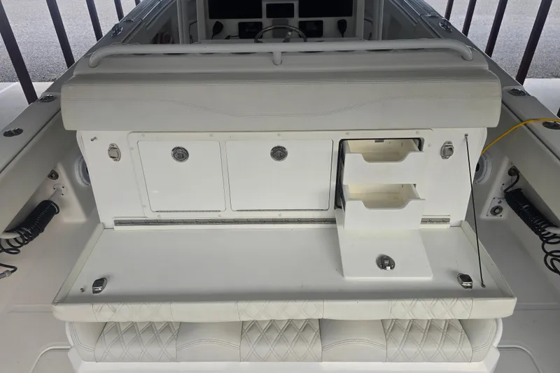 Slide: The Image of 2022 Invincible 33 Catamaran interior with storage compartments and seating. - 30