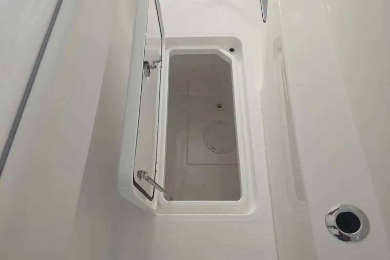 Slide: The Image of Open storage compartment on 2022 Invincible 33 Catamaran boat. - 47