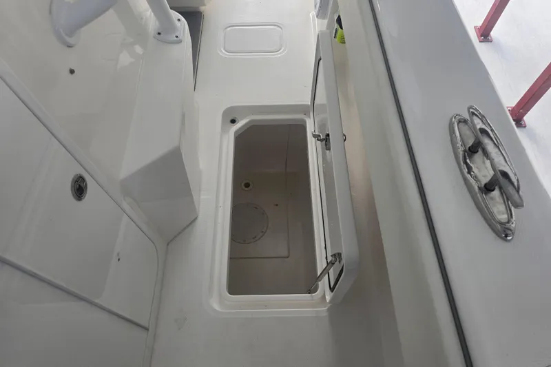 Slide: The Image of Open storage compartment on 2022 Invincible 33 Catamaran boat deck. - 48