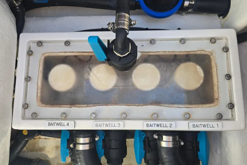 Slide: The Image of Baitwell system on 2022 Invincible 33 Catamaran, featuring labeled compartments and plumbing. - 55