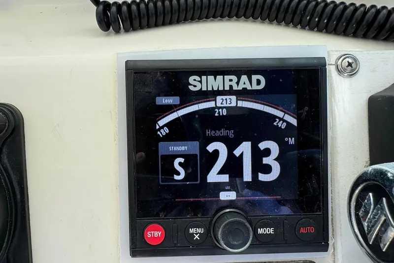 Slide: The Image of Simrad navigation display showing heading 213° on a 2001 Pursuit 2870 Walkaround boat. - 31