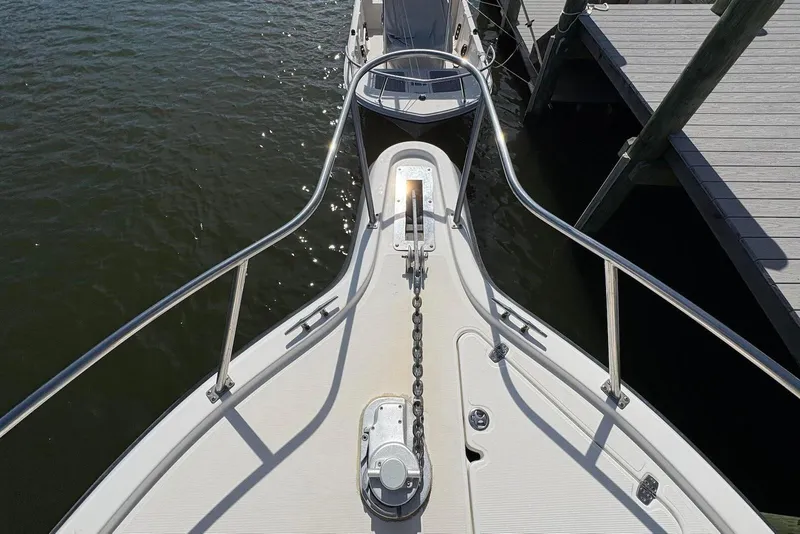 Slide: The Image of Bow view of 2001 Pursuit 2870 Walkaround boat docked at marina. - 33