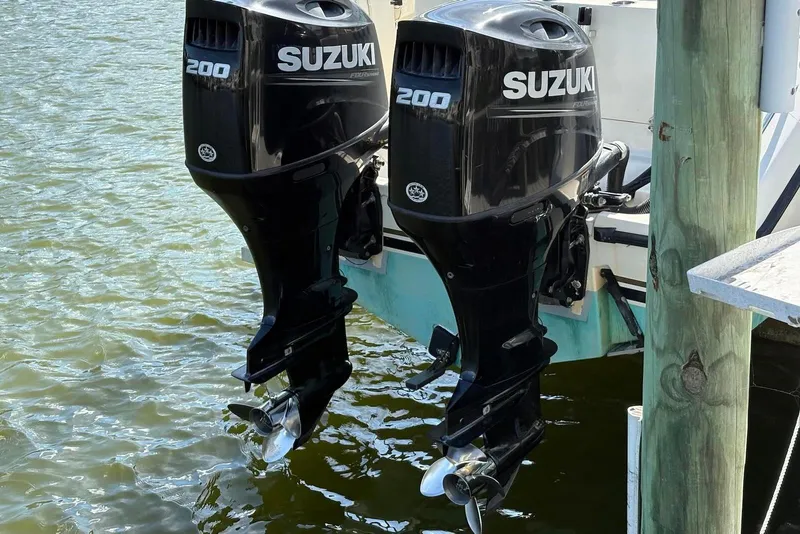Slide: The Image of Twin Suzuki 200 outboard motors on a 2001 Pursuit 2870 Walkaround boat. - 39