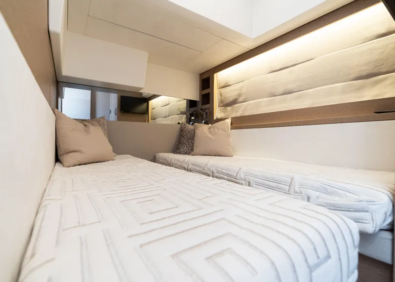 Slide: The Image of Luxurious bedroom in 2019 Prestige 520 Flybridge yacht with modern lighting and cozy bedding. - 10