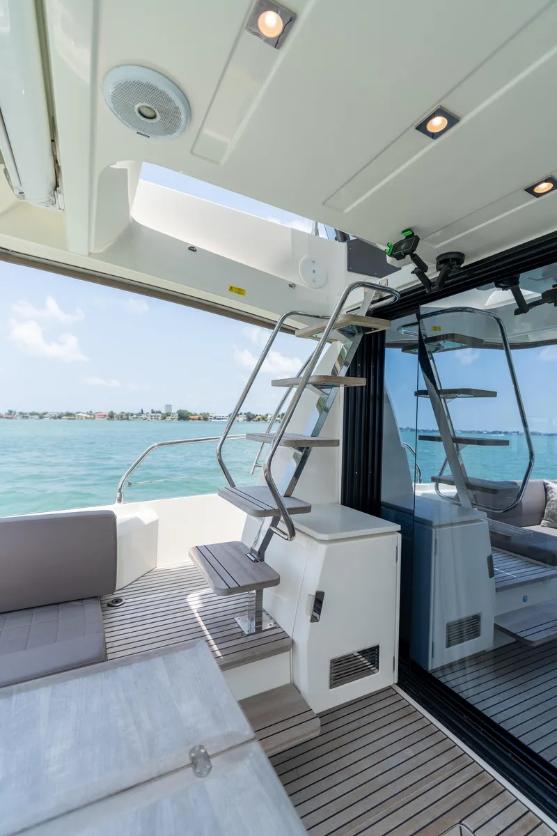 Slide: The Image of 2019 Prestige 520 Flybridge yacht with outdoor seating and ocean view. - 31