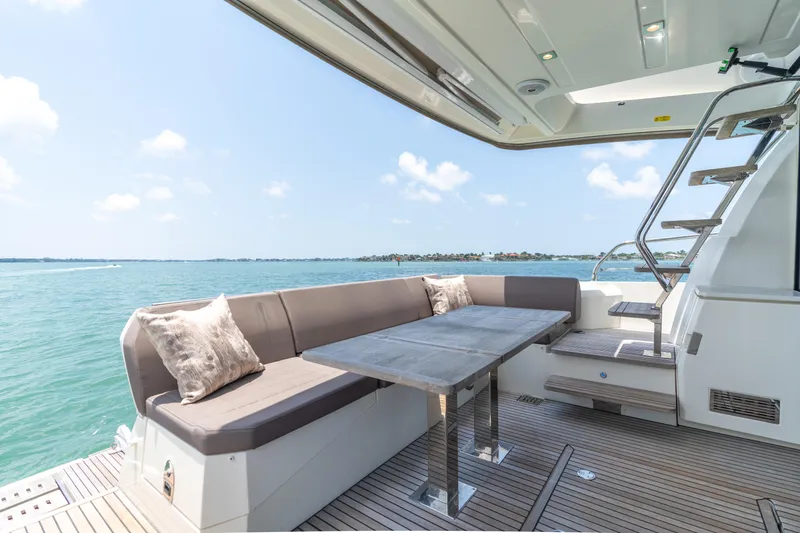 Slide: The Image of Prestige 520 Flybridge 2019 yacht interior with ocean view and modern amenities. - 32