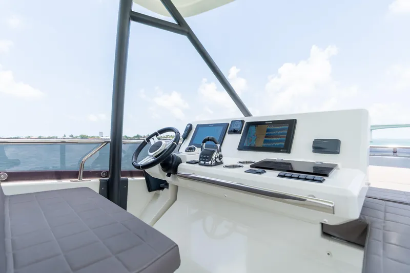 Slide: The Image of Prestige 520 Flybridge 2019 yacht with outdoor seating and ocean view. - 34