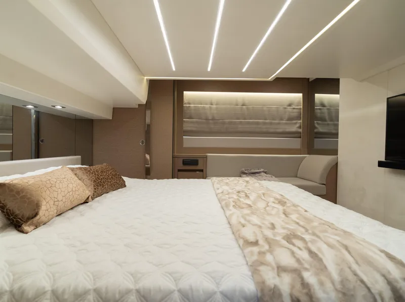 Slide: The Image of Luxurious bedroom interior of 2019 Prestige 520 Flybridge yacht with modern lighting. - 7