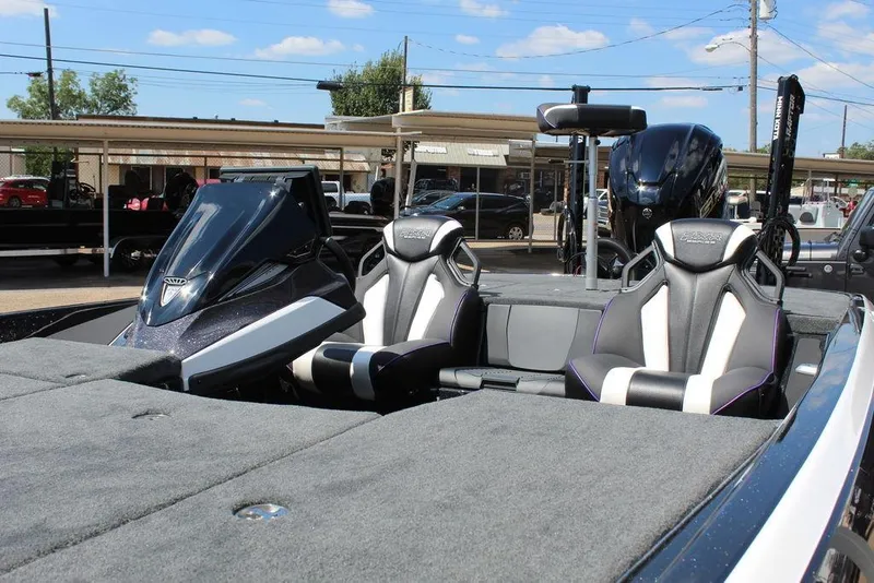 Slide: The Image of 2026 Skeeter FXR21 FLEX boat interior with sleek seats and modern dashboard. - 11