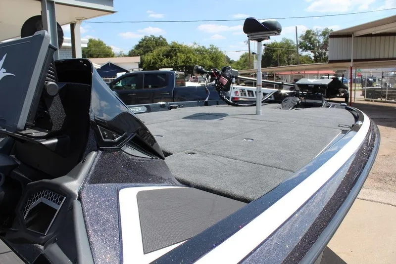 Slide: The Image of 2026 Skeeter FXR21 FLEX boat with spacious deck and advanced navigation equipment. - 14