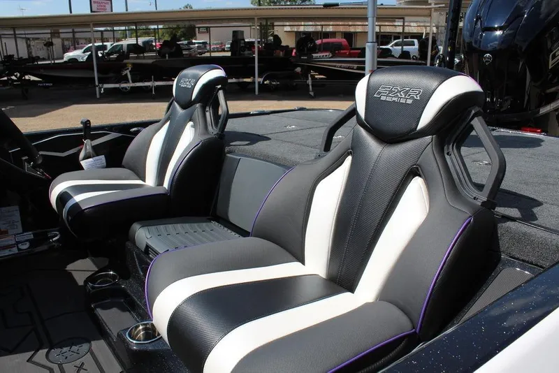 Slide: The Image of 2026 Skeeter FXR21 FLEX boat seats, featuring sleek black and white design with ergonomic support. - 4