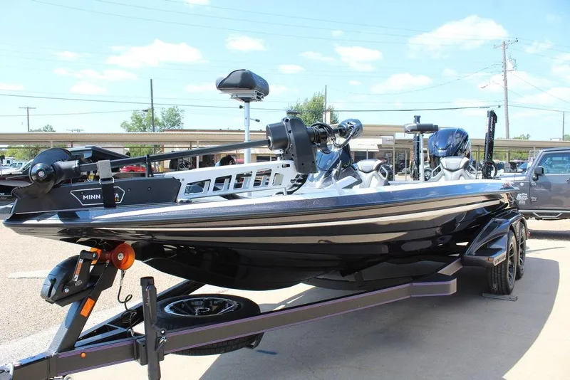 Slide: The Image of 2026 Skeeter FXR21 FLEX boat on trailer, featuring Minn Kota trolling motor. - 5