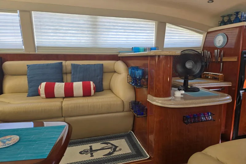 Slide: The Image of Luxurious interior of 2004 Sea Ray 480 Motor Yacht with plush seating and nautical decor. - 11