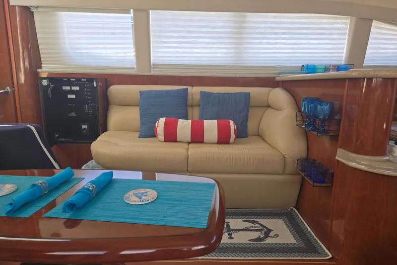 Slide: The Image of Luxurious interior of 2004 Sea Ray 480 Motor Yacht with elegant seating and nautical decor. - 12