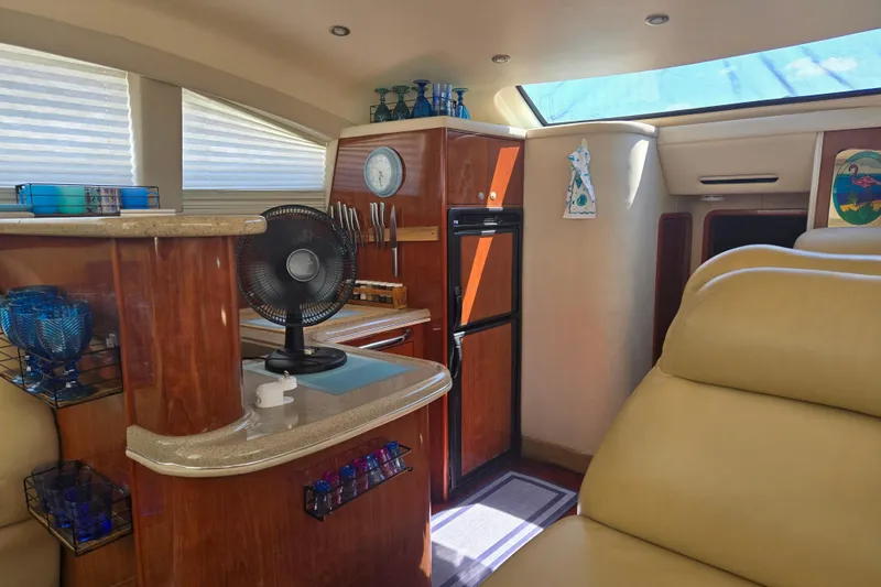 Slide: The Image of Luxurious interior of 2004 Sea Ray 480 Motor Yacht with elegant wood finishes. - 13
