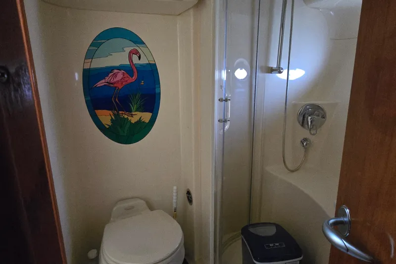 Slide: The Image of Bathroom in 2004 Sea Ray 480 Motor Yacht with flamingo wall art and shower. - 14