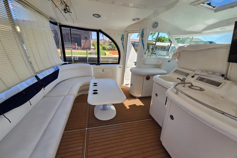 Slide: The Image of Luxurious interior of 2004 Sea Ray 480 Motor Yacht with elegant seating and modern amenities. - 23