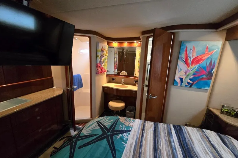Slide: The Image of Luxurious interior of 2004 Sea Ray 480 Motor Yacht with ensuite bathroom and vibrant decor. - 36
