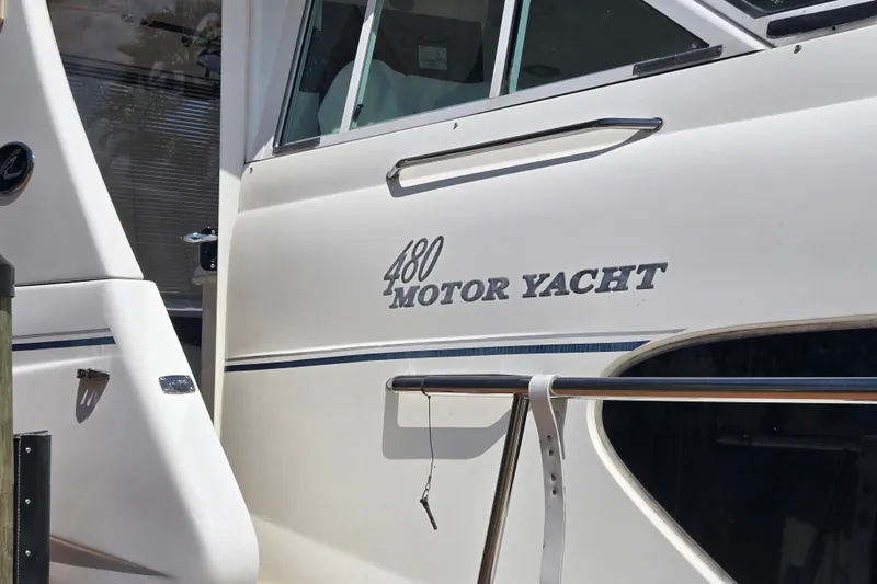 Slide: The Image of 2004 Sea Ray 480 Motor Yacht side view with model name displayed. - 7