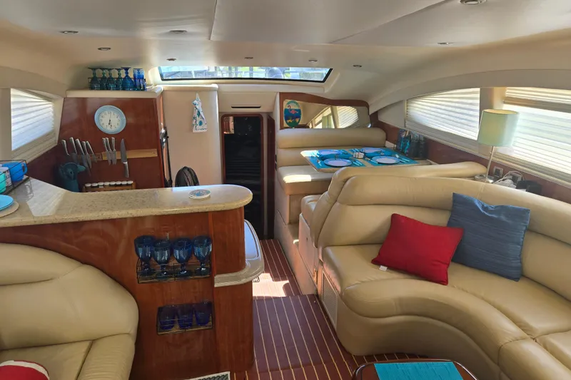 Slide: The Image of Luxurious 2004 Sea Ray 480 Motor Yacht interior with elegant seating and dining area. - 8