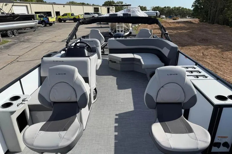 Slide: The Image of 2026 Lowe LF 194 pontoon boat with spacious seating and modern design. - 11