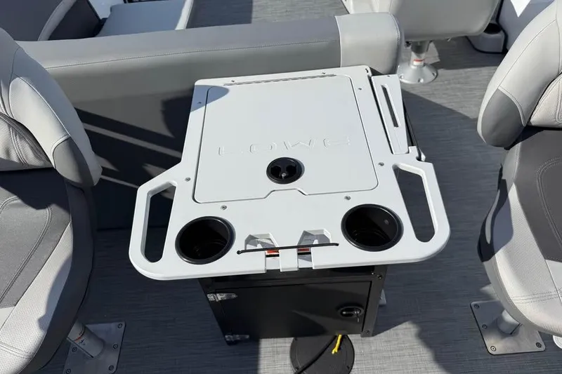 Slide: The Image of 2026 Lowe LF 194 boat interior with seating and a central console table. - 12