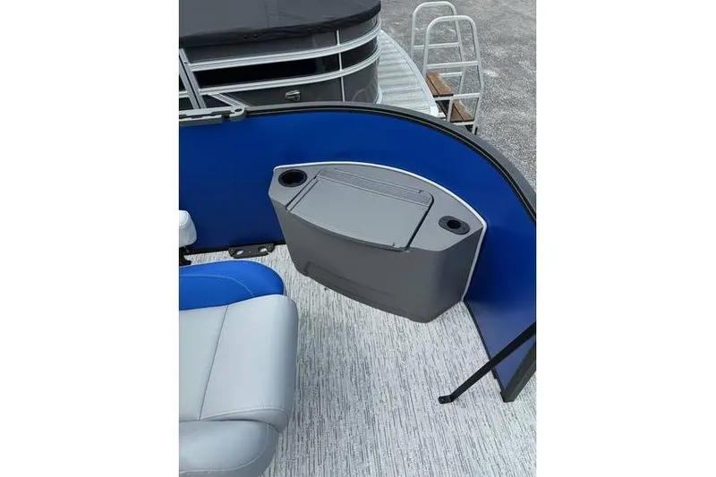 Slide: The Image of 2026 Bennington 23 SF Family boat interior with seating and storage compartment. - 13