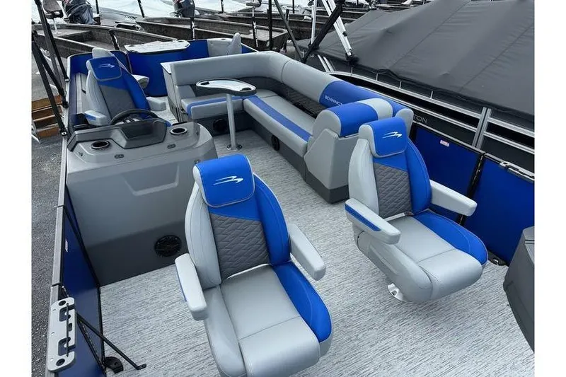 Slide: The Image of 2026 Bennington 23 SF Family boat interior with blue and gray seating, four fish seats. - 15
