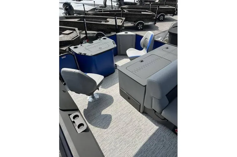 Slide: The Image of 2026 Bennington 23 SF Family boat interior with seating and fishing setup. - 24