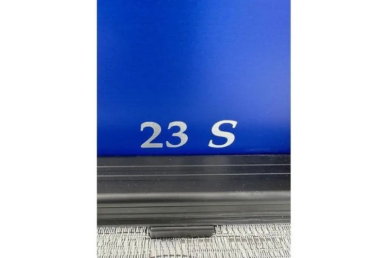 Slide: The Image of Close-up of blue Bennington 23 S model boat, 2026 edition. - 3