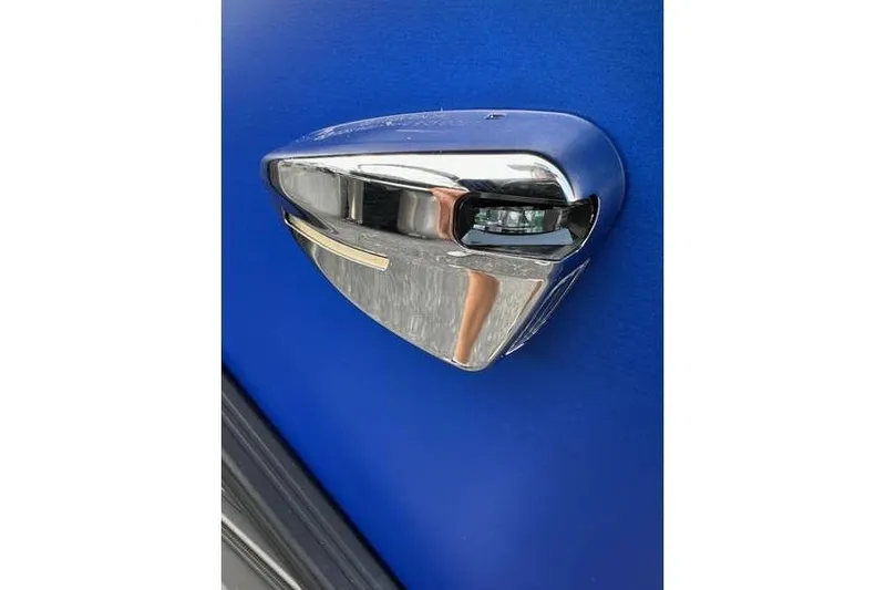 Slide: The Image of Chrome detail on 2026 Bennington 23 SF Family boat against blue background. - 41