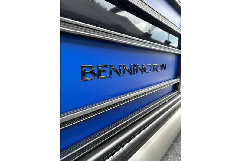 Slide: The Image of Close-up of 2026 Bennington 23 SF Family boat with blue panel and logo. - 5