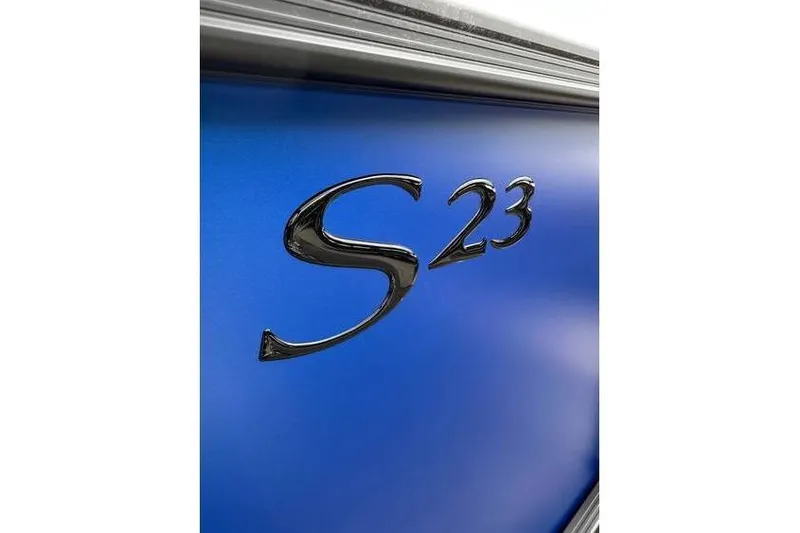 Slide: The Image of Close-up of 2026 Bennington 23 SF Family boat emblem on blue surface. - 6