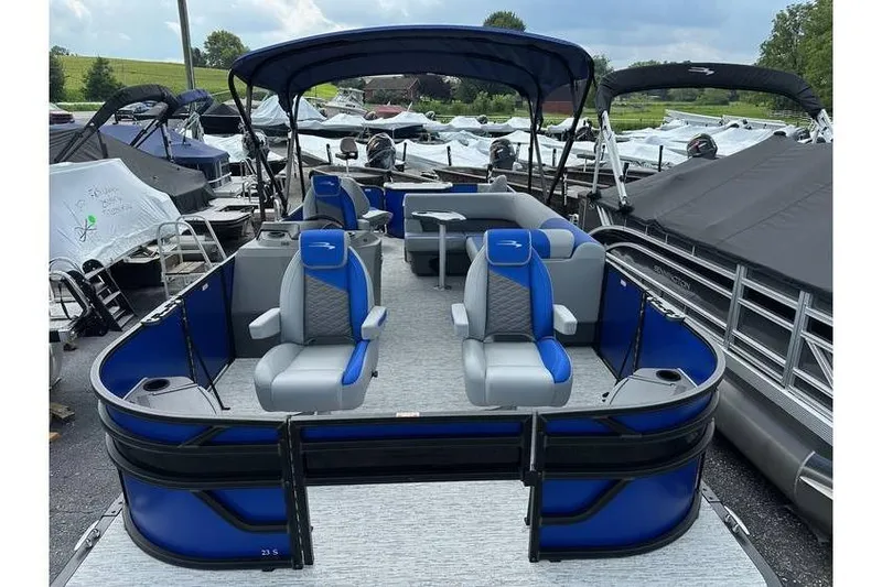 Slide: The Image of 2026 Bennington 23 SF Family pontoon boat with blue accents and four fishing seats. - 9