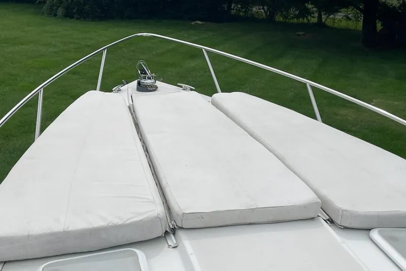 Slide: The Image of Bow view of 2004 Formula 330 Sun Sport boat with cushioned seating. - 11