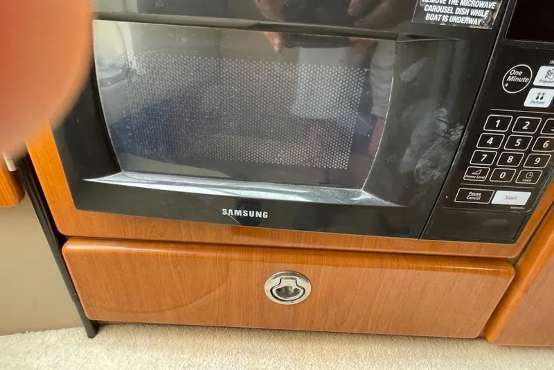Slide: The Image of Samsung microwave in a 2004 Formula 330 Sun Sport boat kitchen. - 14