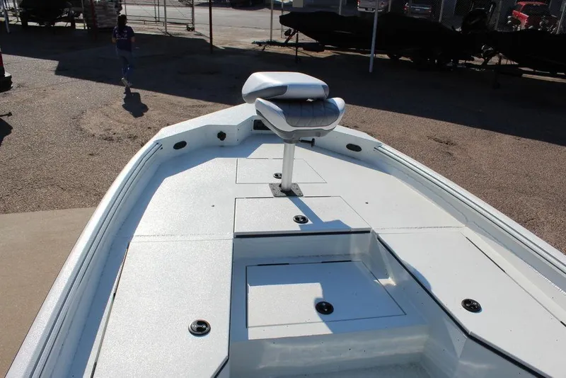 Slide: The Image of 2026 Excel Bay Pro Elite 220 boat deck with seating, in a sunny outdoor setting. - 13