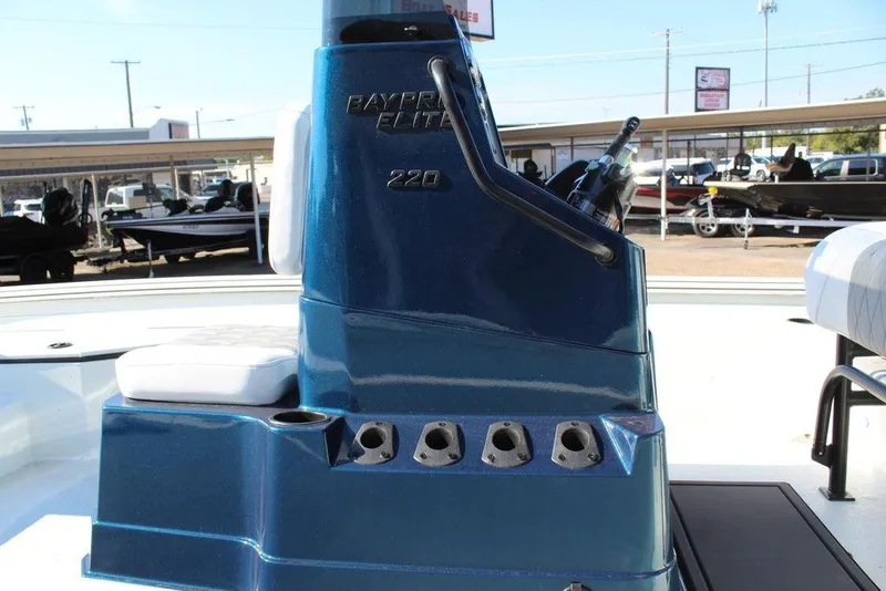 Slide: The Image of 2026 Excel Bay Pro Elite 220 boat console with seating and controls. - 14