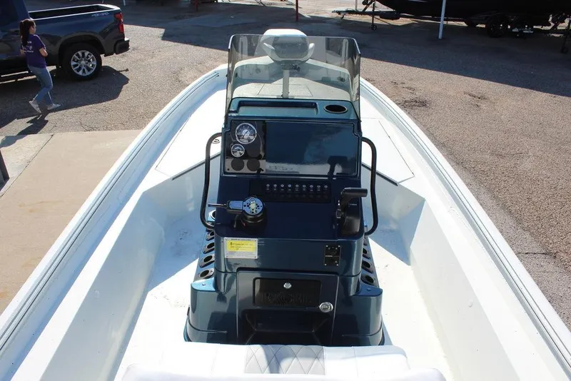 Slide: The Image of 2026 Excel Bay Pro Elite 220 boat console with steering wheel and controls. - 15