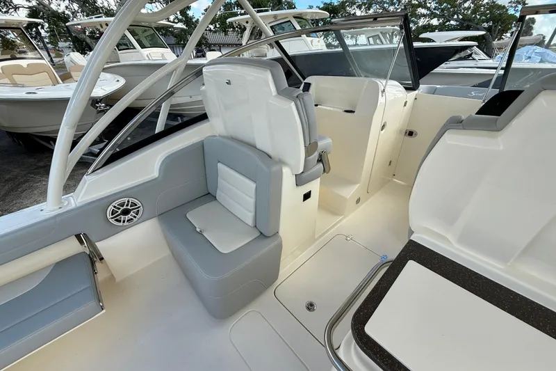 Slide: The Image of 2026 Scout 255 Dorado boat interior with seating and helm area. - 12